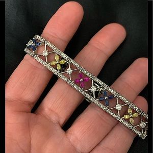 Sterling Silver bracelet with pink, yellow and blue stones.
